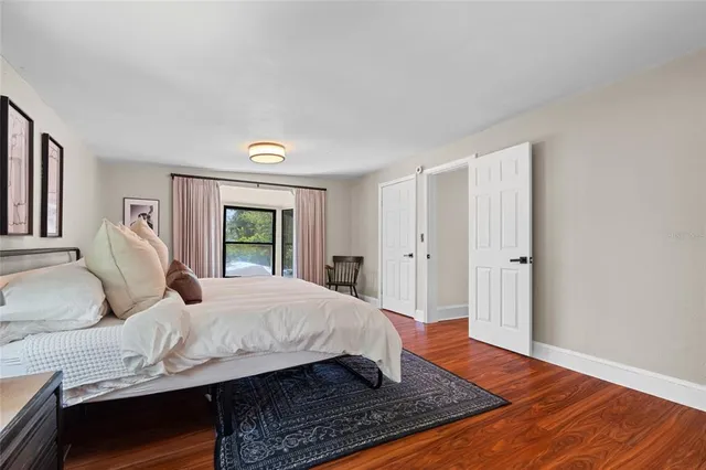 a bedroom with a bed and window