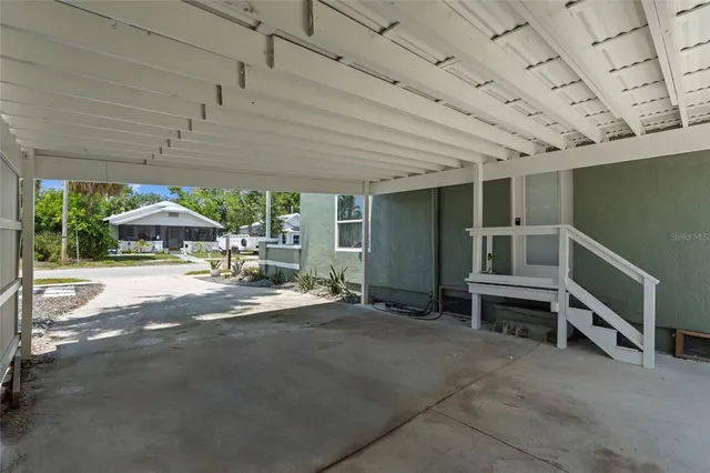 a view of an empty room with a tv