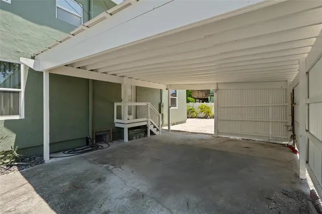 a view of a room with furniture and a window