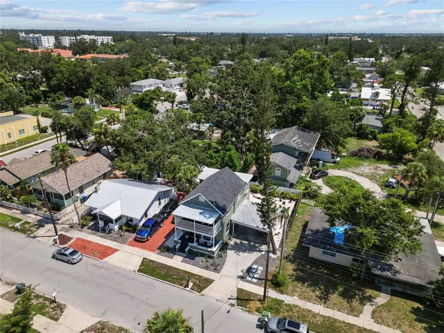 an aerial view of a house with a yard