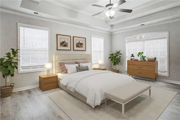 a bedroom with a large bed and a chandelier