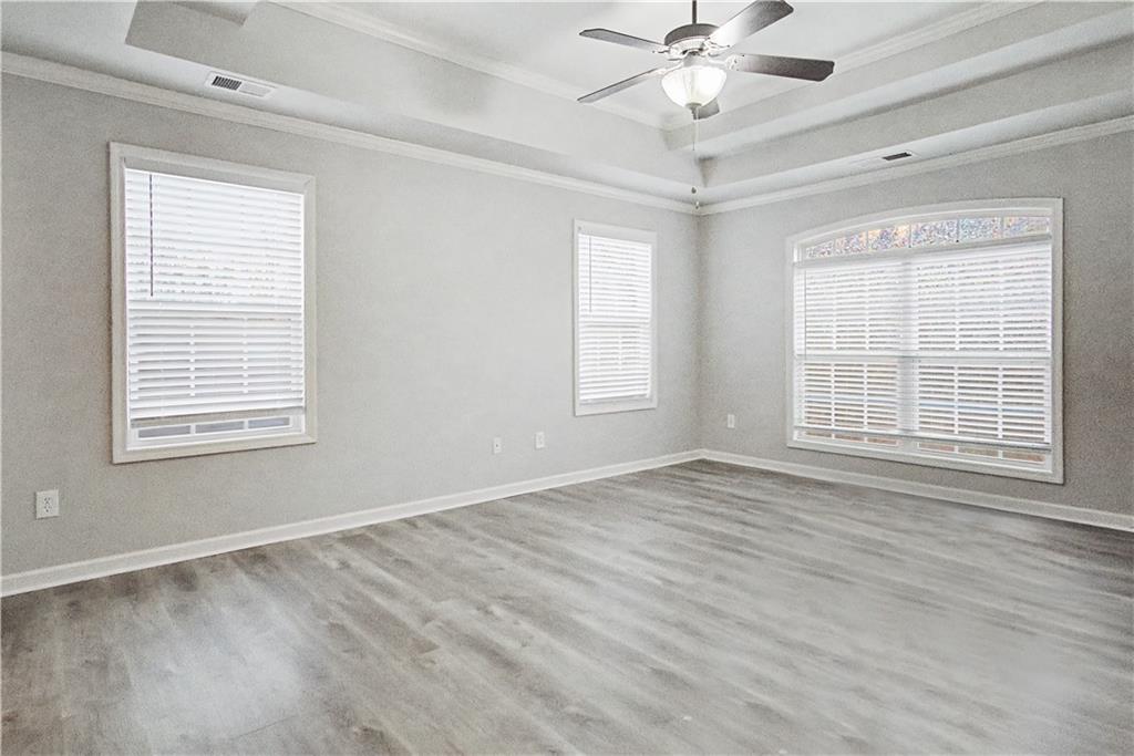 408 Long Branch Way Canton, GA 30115 - Photo 25 of 43 a view of an empty room with a window and a chandelier fan