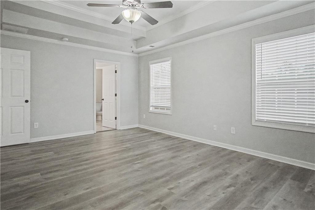 408 Long Branch Way Canton, GA 30115 - Photo 26 of 43 a view of an empty room with wooden floor and a window