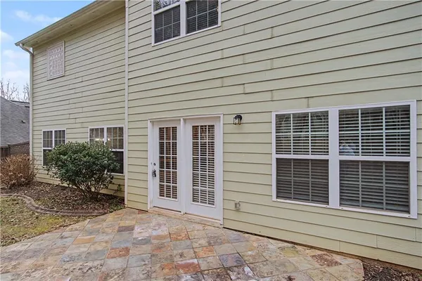 a view of a house with a door and a large window