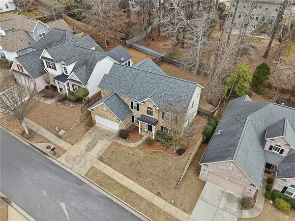 an aerial view of a house with swimming pool