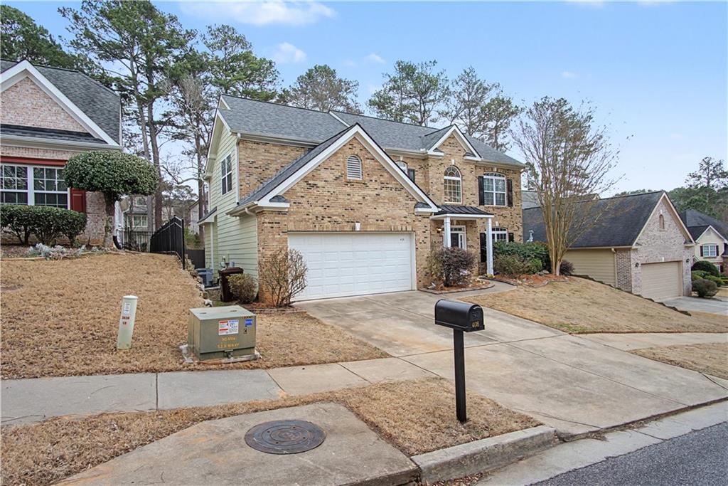 408 Long Branch Way Canton, GA 30115 - Photo 38 of 43 a front view of a house with garden