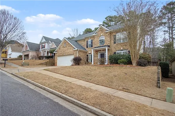 a front view of a house with a yard