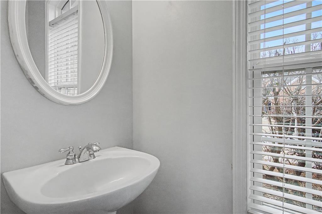 408 Long Branch Way Canton, GA 30115 - Photo 6 of 43 a bathroom with a sink and a mirror
