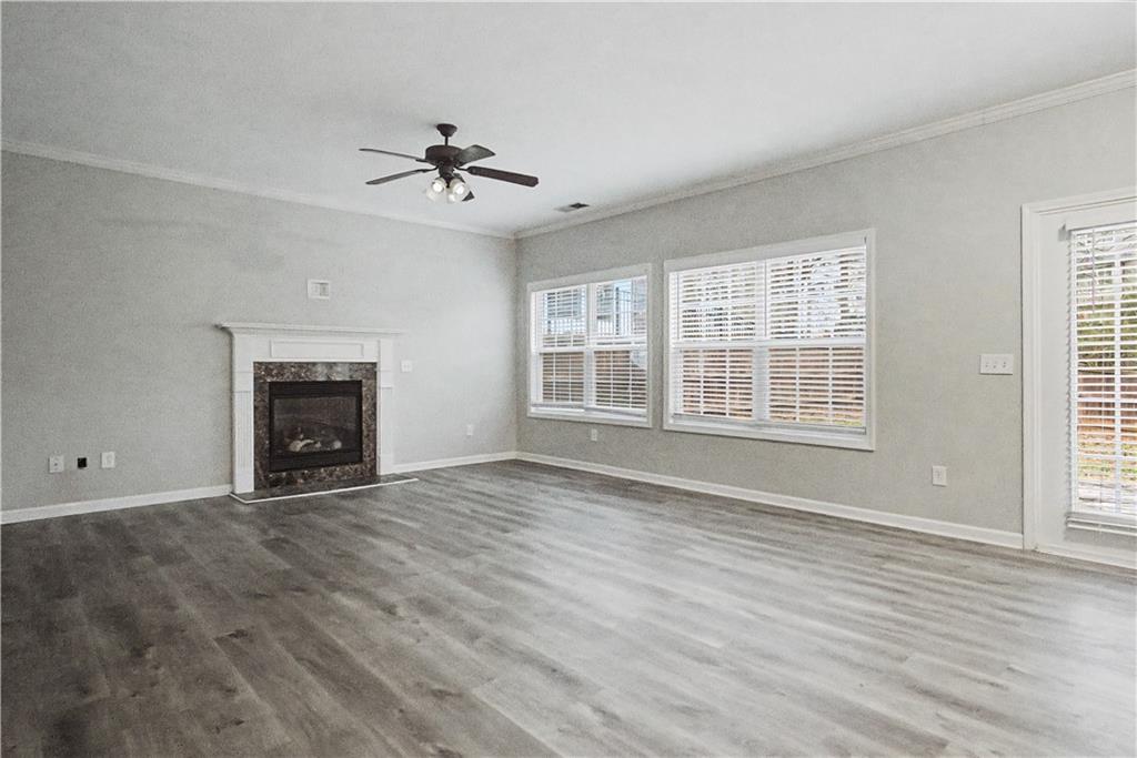 408 Long Branch Way Canton, GA 30115 - Photo 8 of 43 wooden floor fireplace and windows in an empty room