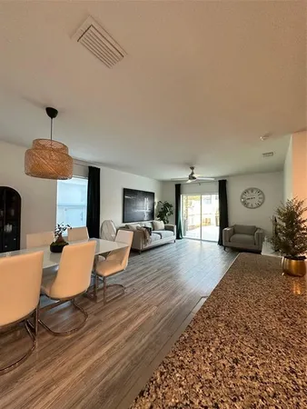 a kitchen with stainless steel appliances granite countertop a sink and a stove