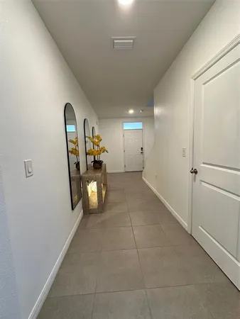 a living room with couches and painted walls