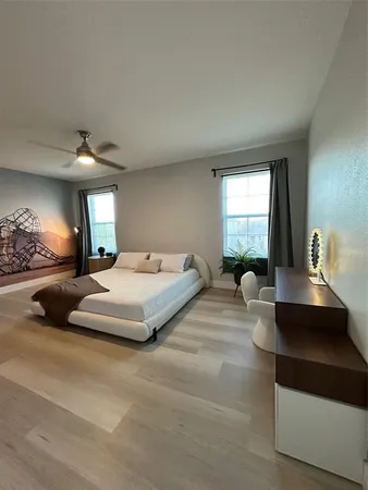 a bedroom with a bed and window