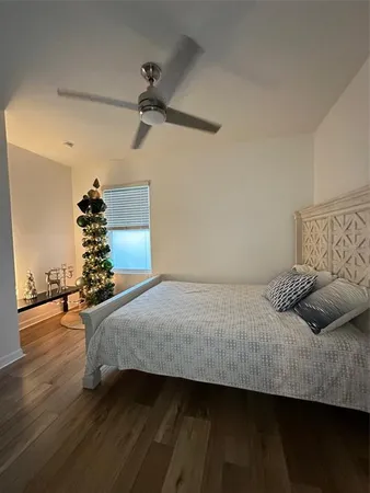 a bed room with a bed and a large window