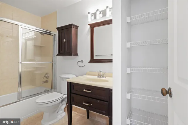 a view of storage and utility room with washer and dryer