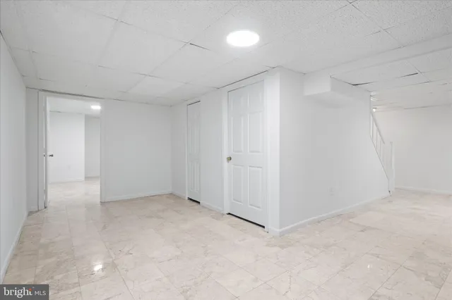 a white toilet sitting next to a bathroom sink