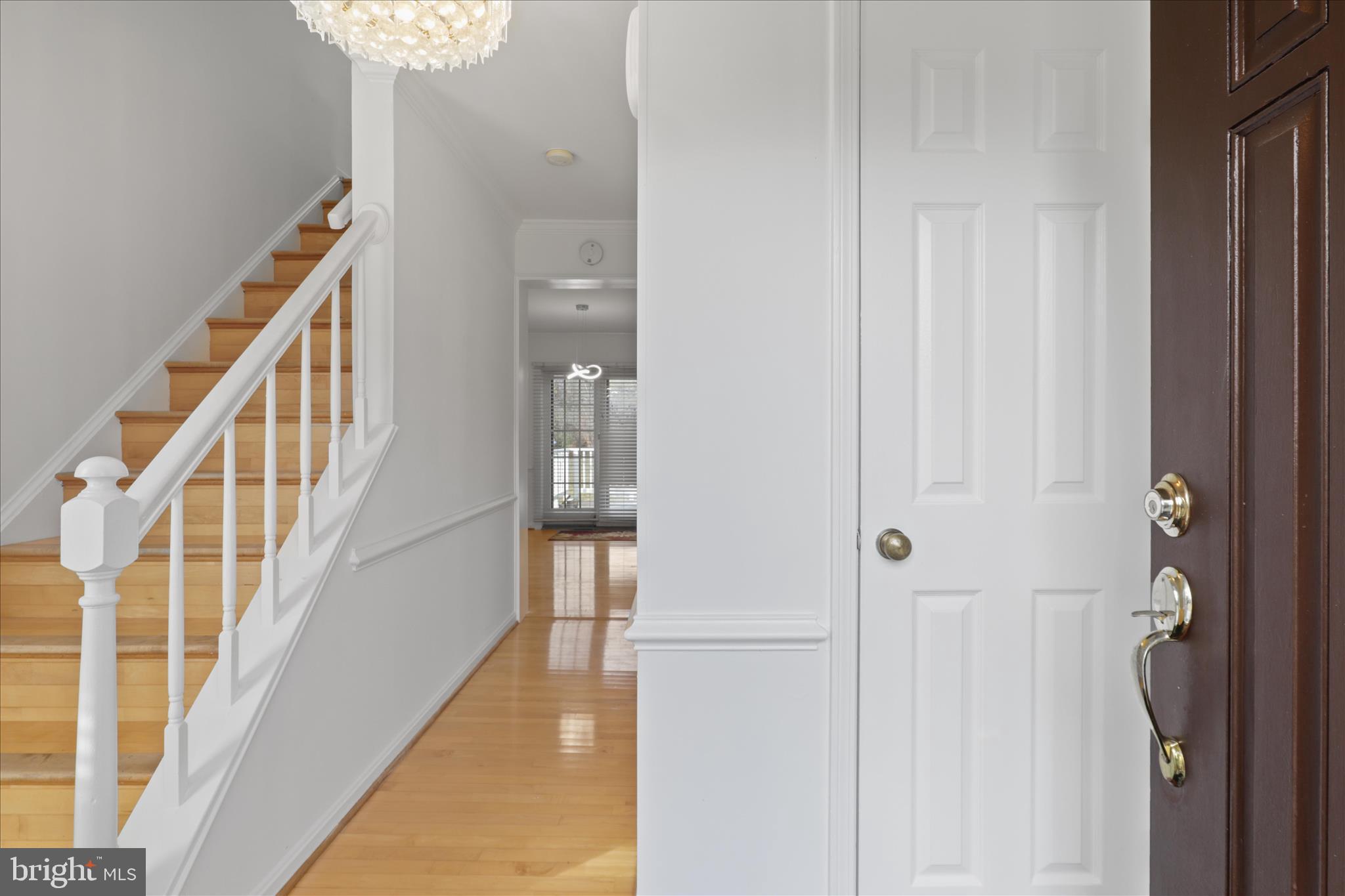 836 Utterback Store Road Great Falls, VA 22066 - Photo 4 of 30 a view of a hallway with wooden floor and staircase