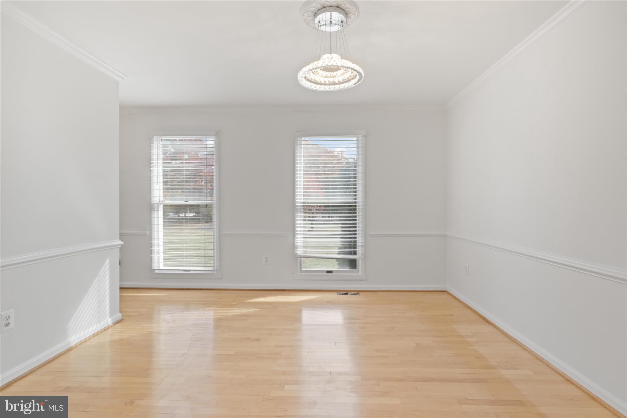 836 Utterback Store Road Great Falls, VA 22066 - Photo 5 of 30 wooden floor in an empty room with a window
