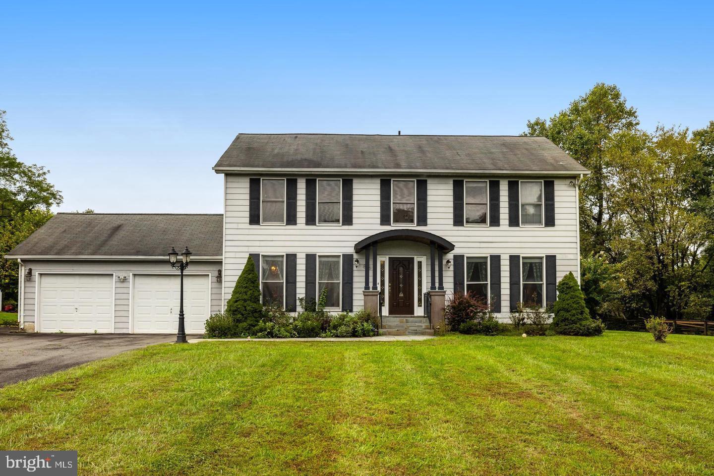 836 Utterback Store Road Great Falls, VA 22066 - Photo 7 of 30 a front view of a house with a yard