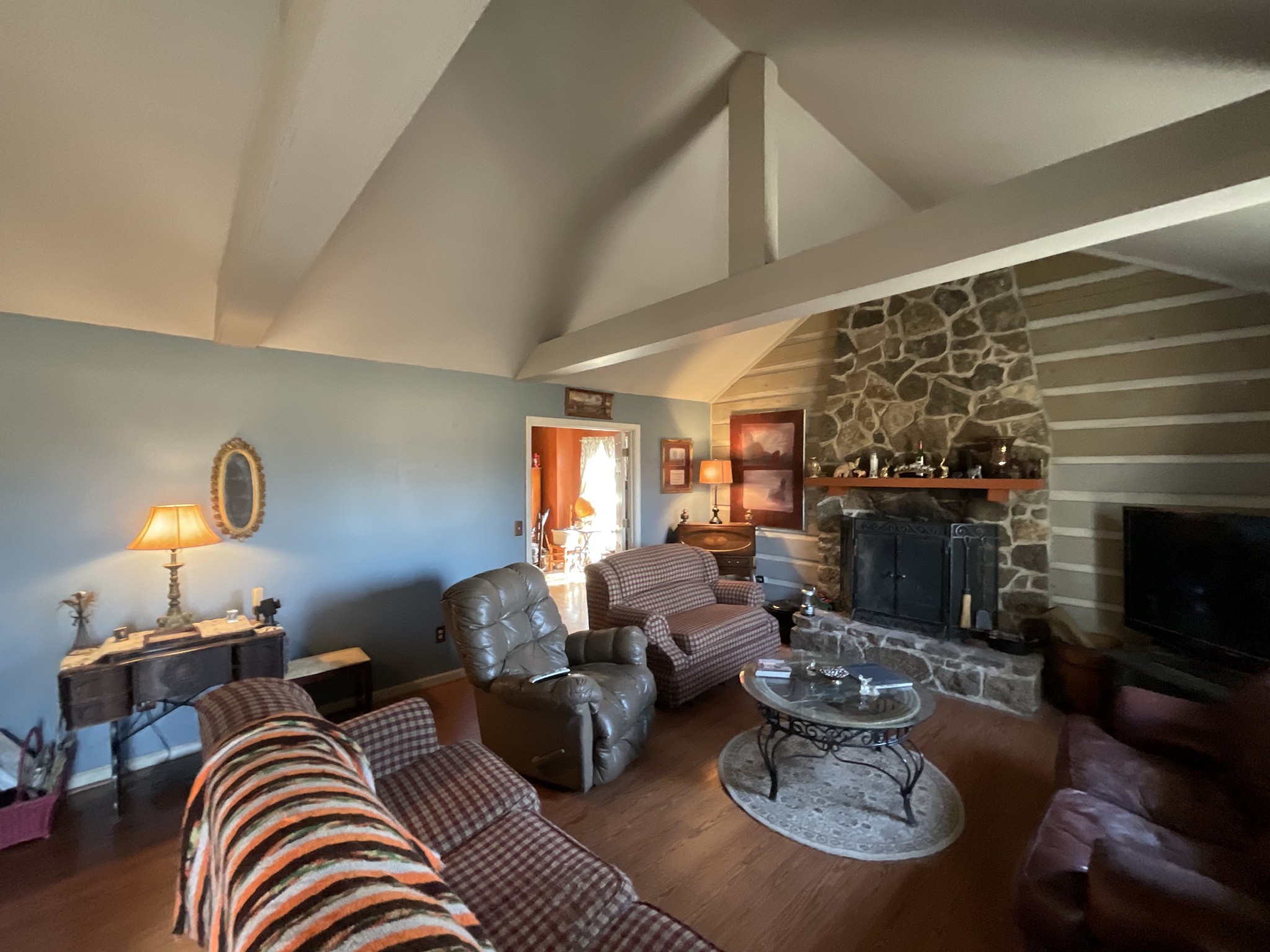 9173 Versailles Road Rockvale, TN 37153 - Photo 11 of 66 a living room with furniture a fireplace and a flat screen tv