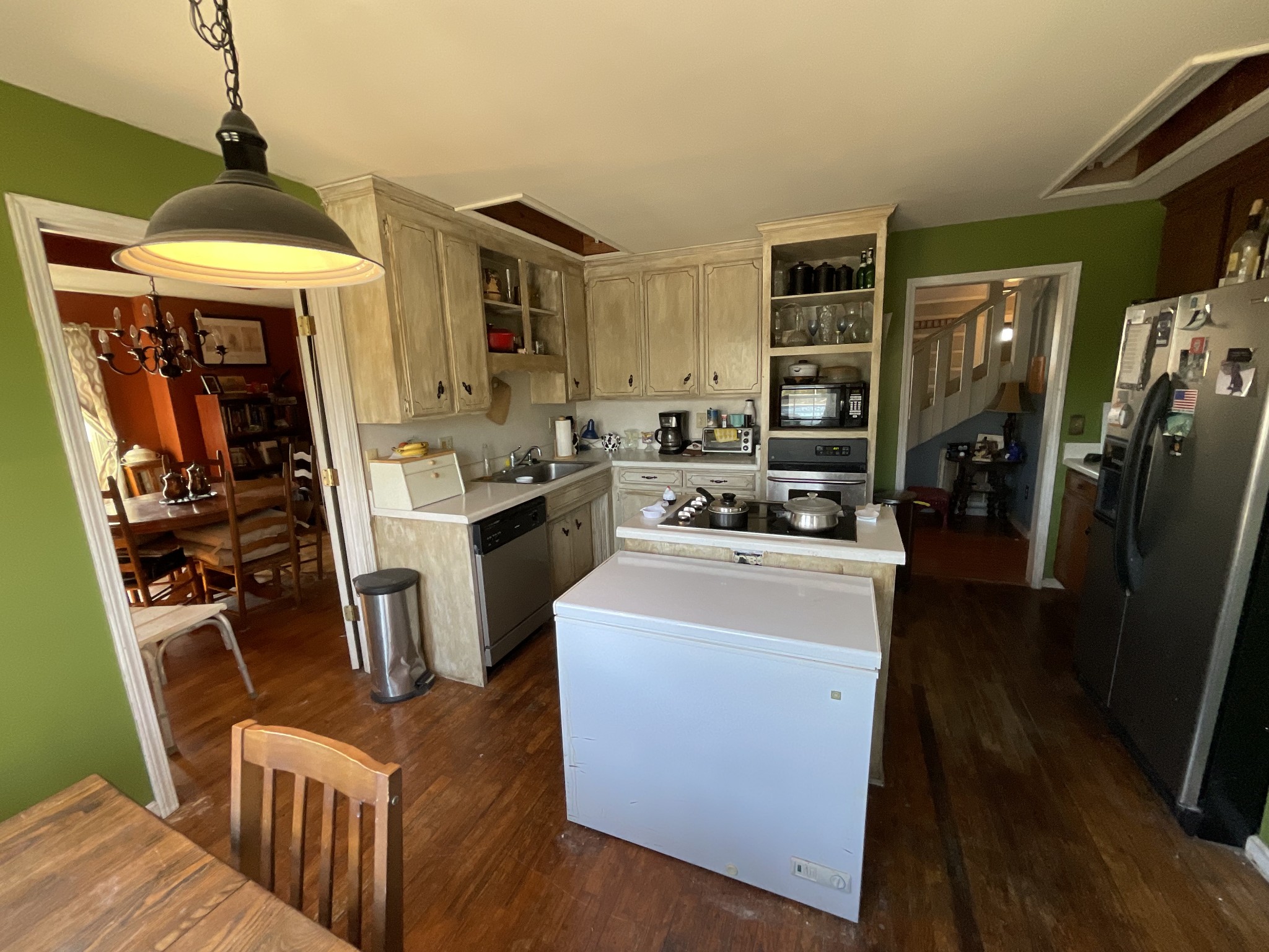 9173 Versailles Road Rockvale, TN 37153 - Photo 23 of 66 a kitchen with stainless steel appliances kitchen island a stove a refrigerator and a view of living room