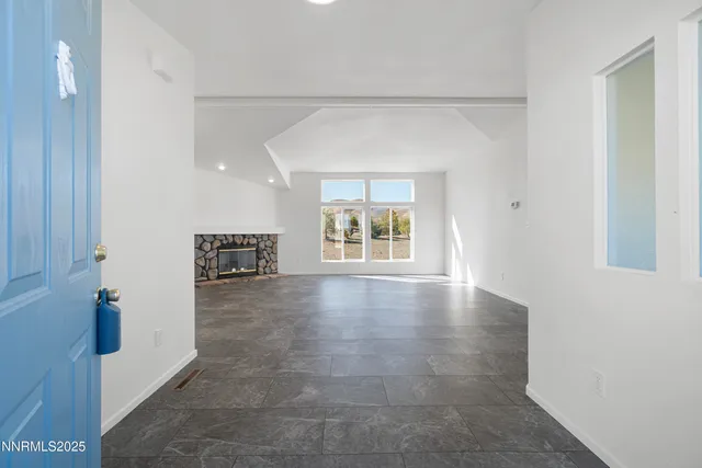 a view of livingroom with hardwood floor and hallway