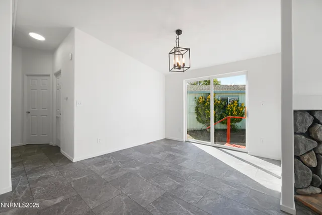 a view of a kitchen with a sink and a refrigerator