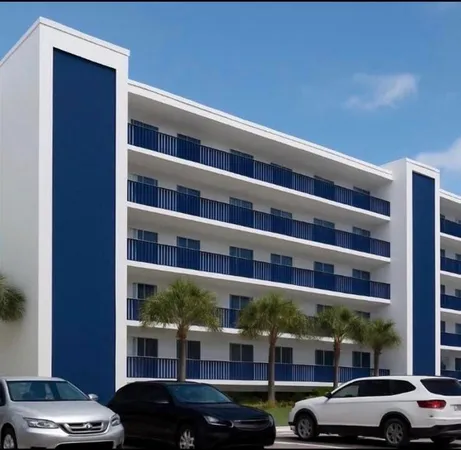 a view of cars parked in front of a building
