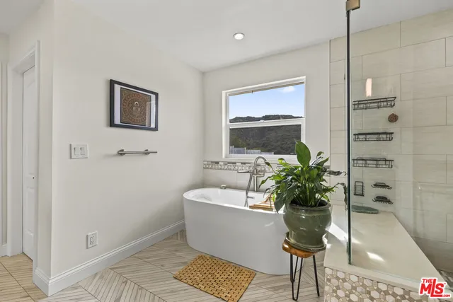 a white bath tub sitting in a bathroom