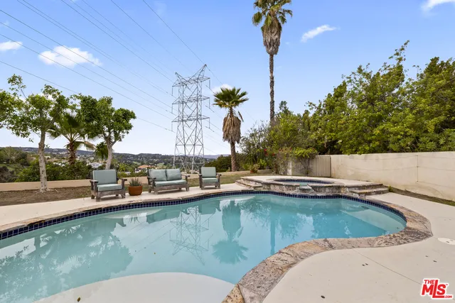 a view of a patio with a table and chairs