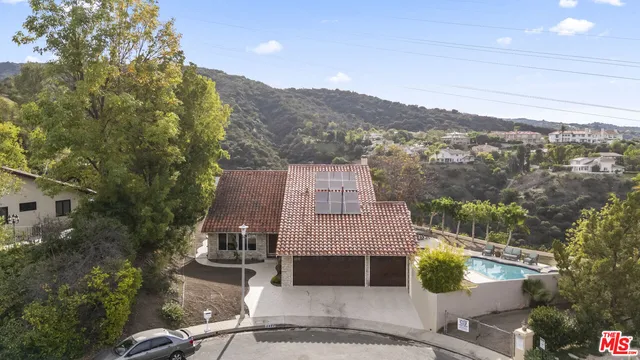 an aerial view of residential houses and outdoor space