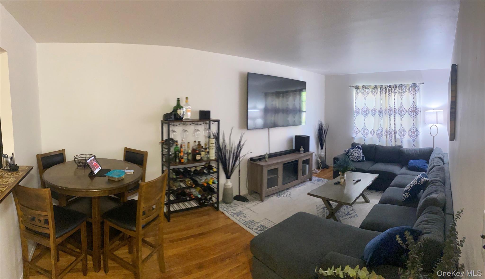 84-24 98th Street, Unit 1 Queens, NY 11421 - Photo 8 of 22 a living room with furniture and a fireplace