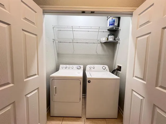 a utility room with dryer and washer