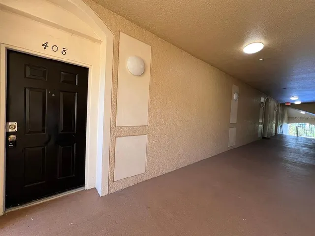 a view of a hallway with closet