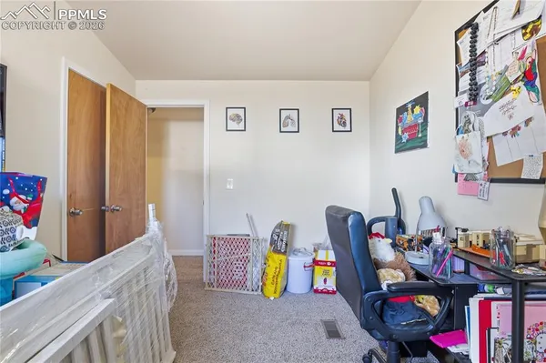 a view of a workspace with furniture