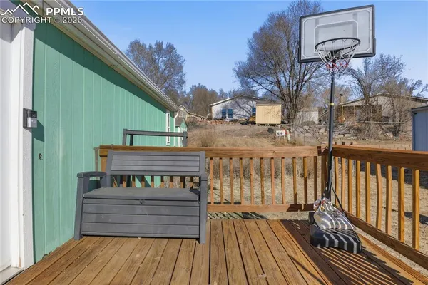 a view of a wooden deck with a bench