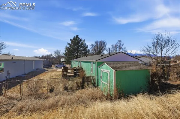 a view of a yard in front of a house