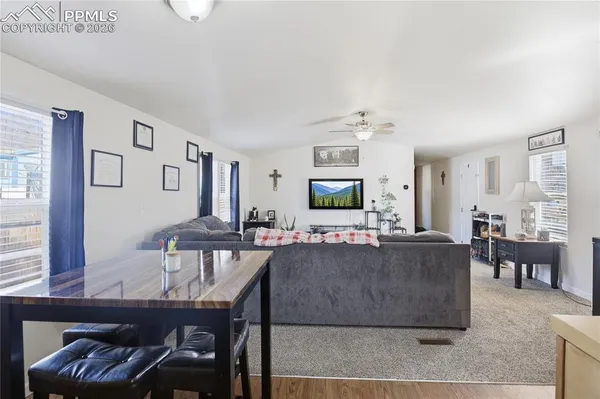 a living room with furniture and a flat screen tv