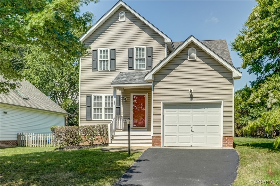 11452 Pinedale Drive Glen Allen, VA 23059 - Photo 1 of 25 a front view of a house with a yard and garage