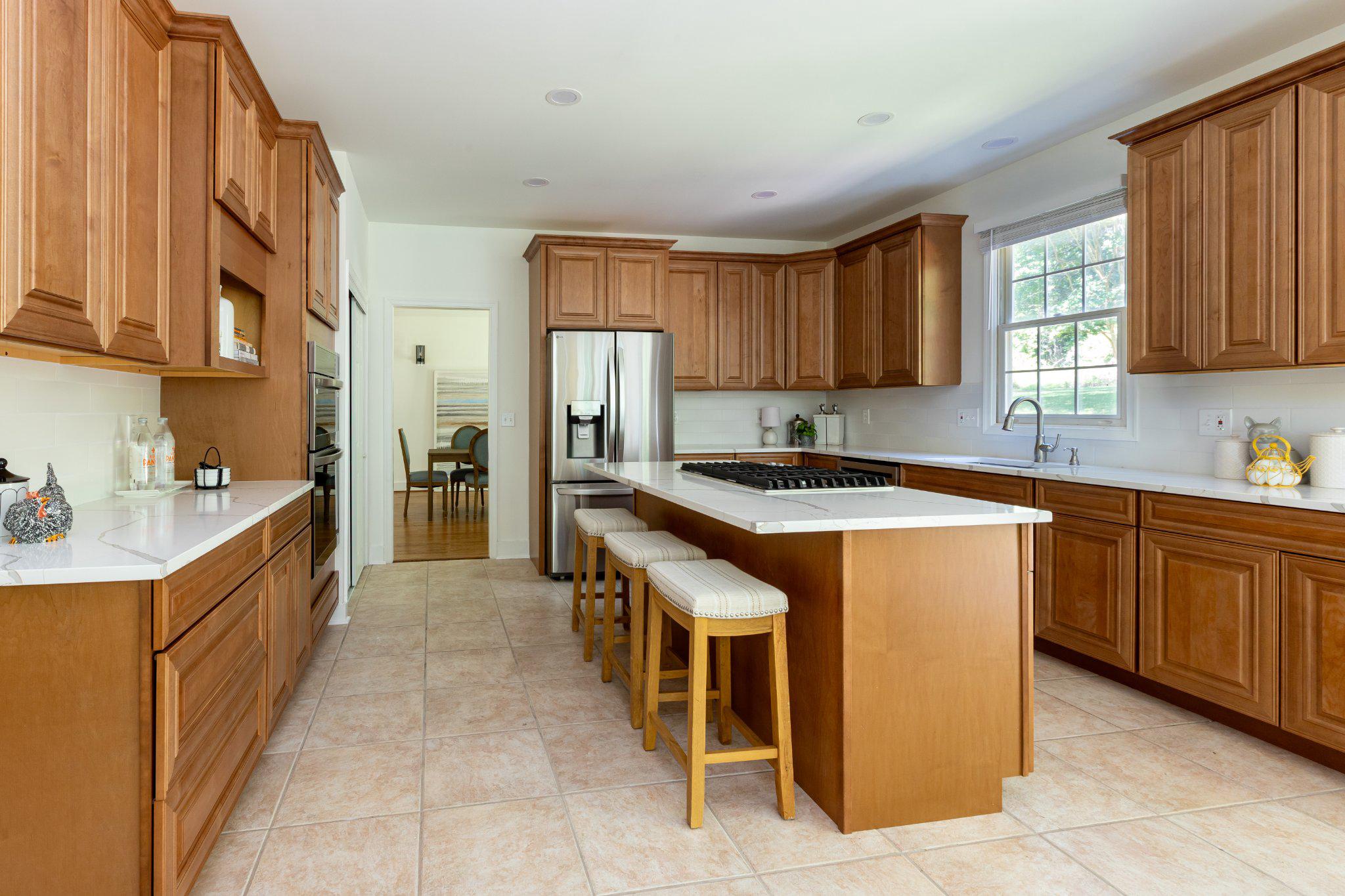 7009 Persimmon Tree Road Bethesda, MD 20817 - Photo 10 of 63 Kitchen - Center Cooktop Island, New Appliances