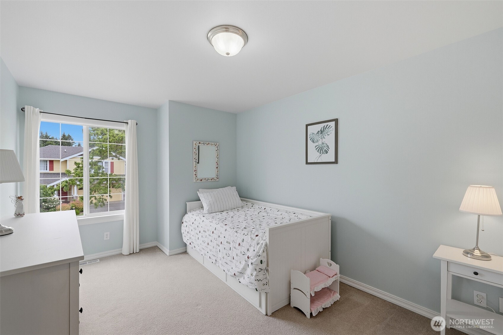 17747 89th Court Northeast Bothell, WA 98011 - Photo 22 of 33 a bedroom with a bed and a lamp