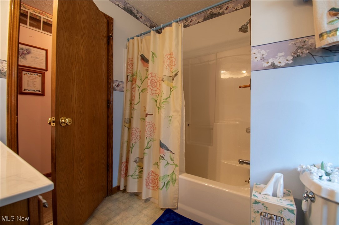 65525 Larrick Ridge Road Cambridge, OH 43725 - Photo 12 of 40 Bathroom featuring the shower / bath combo