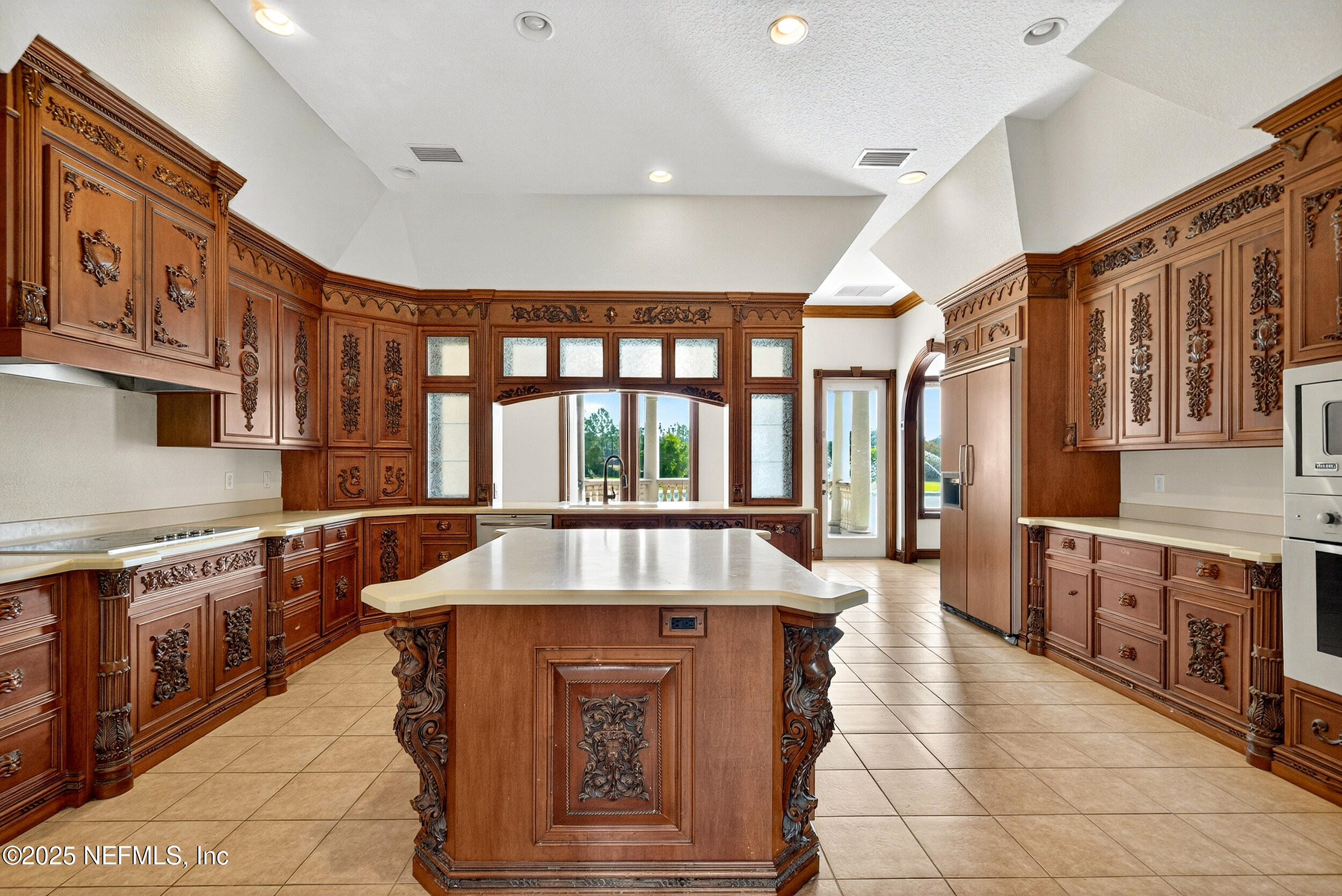 45500 Stratton Road Callahan, FL 32011 - Photo 11 of 58 a large kitchen with stainless steel appliances granite countertop a large stove a sink and dishwasher