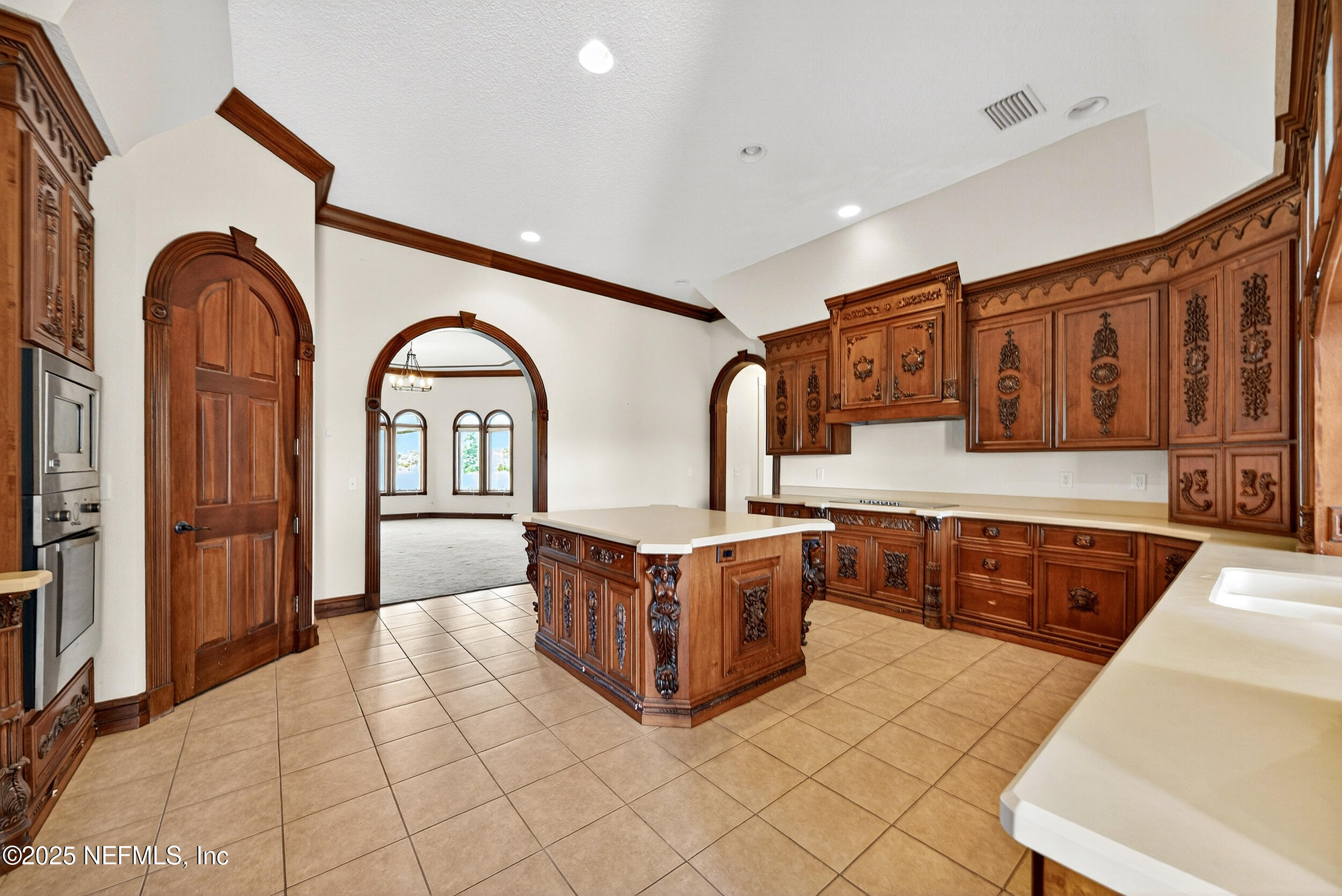45500 Stratton Road Callahan, FL 32011 - Photo 12 of 58 a living room with stainless steel appliances kitchen island granite countertop a stove top oven a sink and a refrigerator