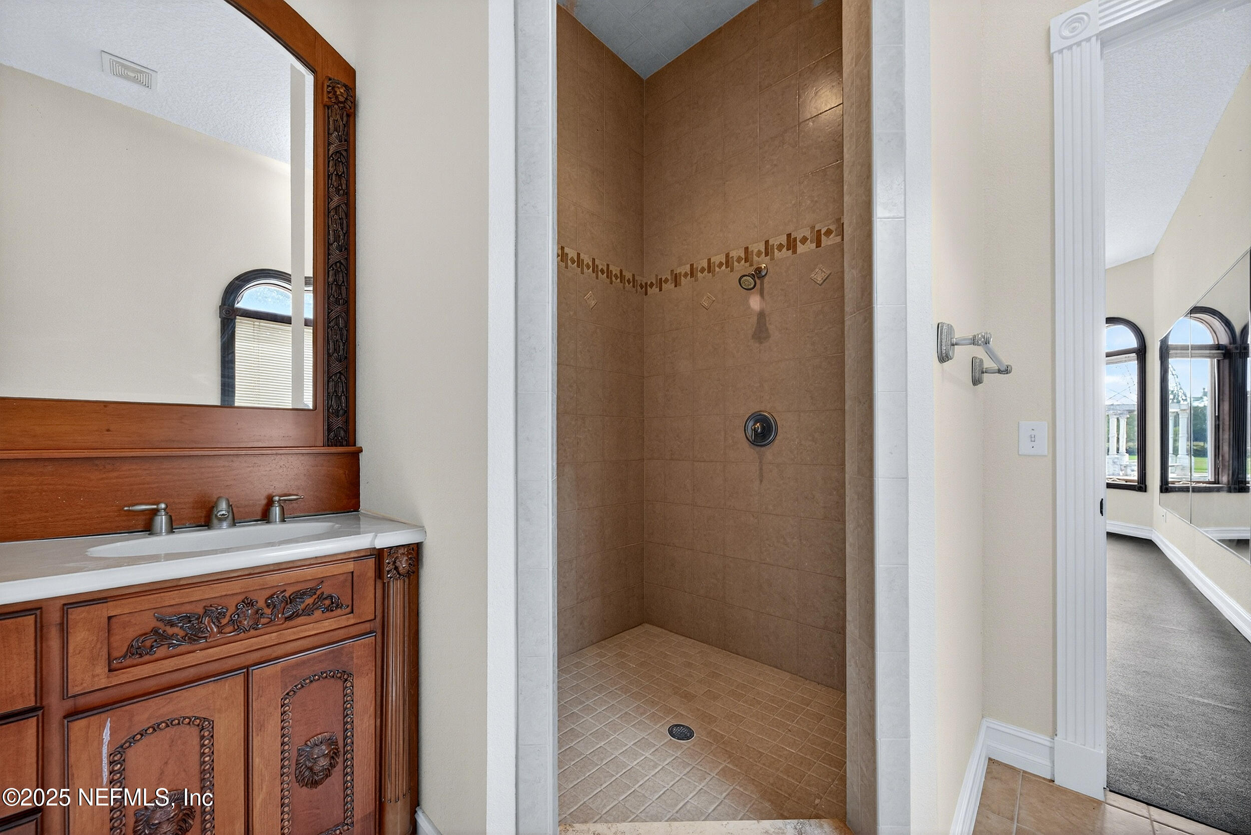 45500 Stratton Road Callahan, FL 32011 - Photo 18 of 58 a bathroom with a sink and a mirror