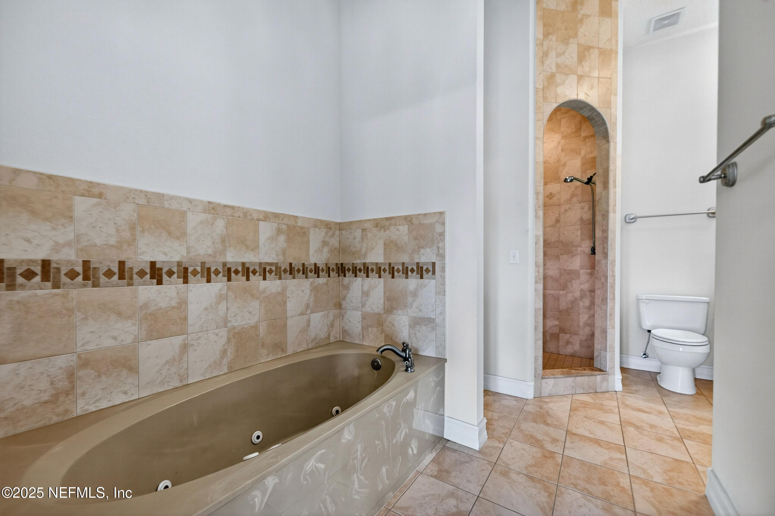 45500 Stratton Road Callahan, FL 32011 - Photo 29 of 58 a bathroom with a bathtub and a shower