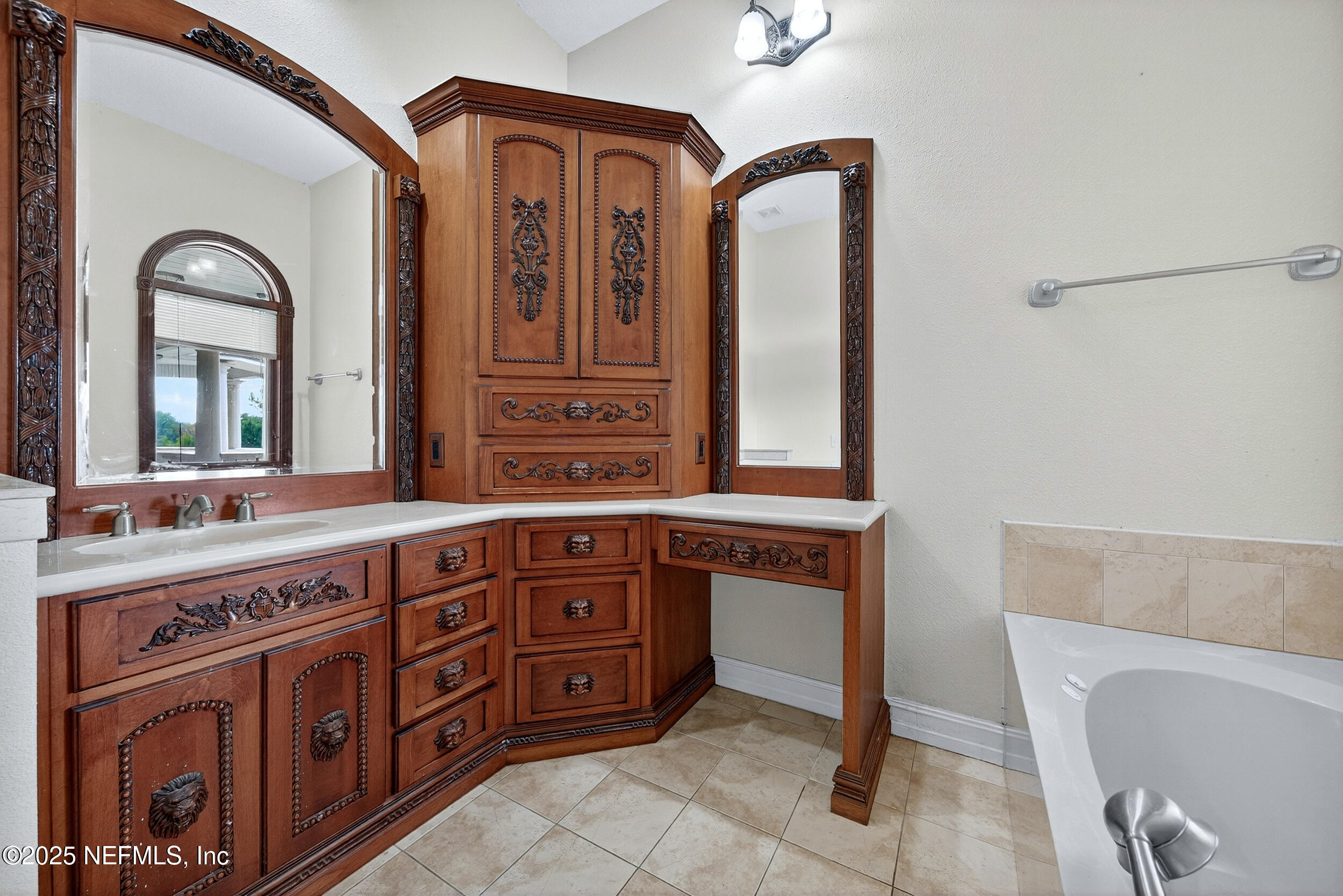 45500 Stratton Road Callahan, FL 32011 - Photo 33 of 58 a spacious bathroom with a granite countertop sink a mirror and a