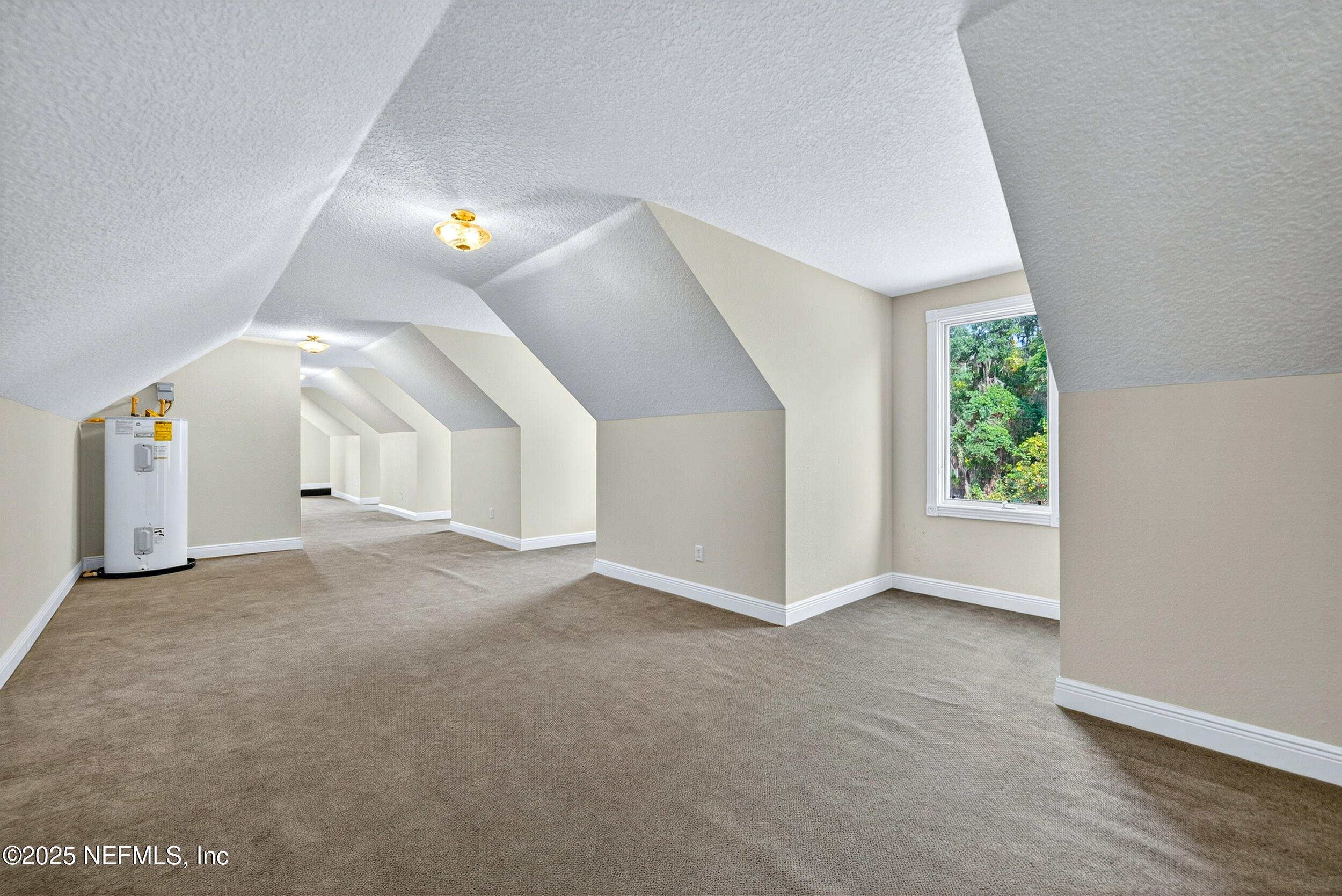 45500 Stratton Road Callahan, FL 32011 - Photo 38 of 58 a view of a big room with windows and chandelier