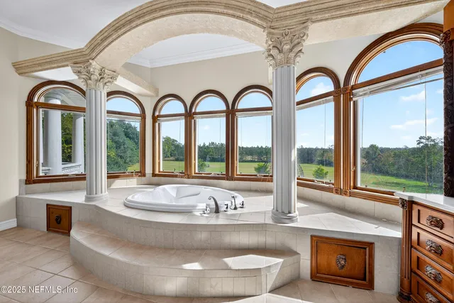 an aerial view of a house with yard swimming pool and outdoor seating