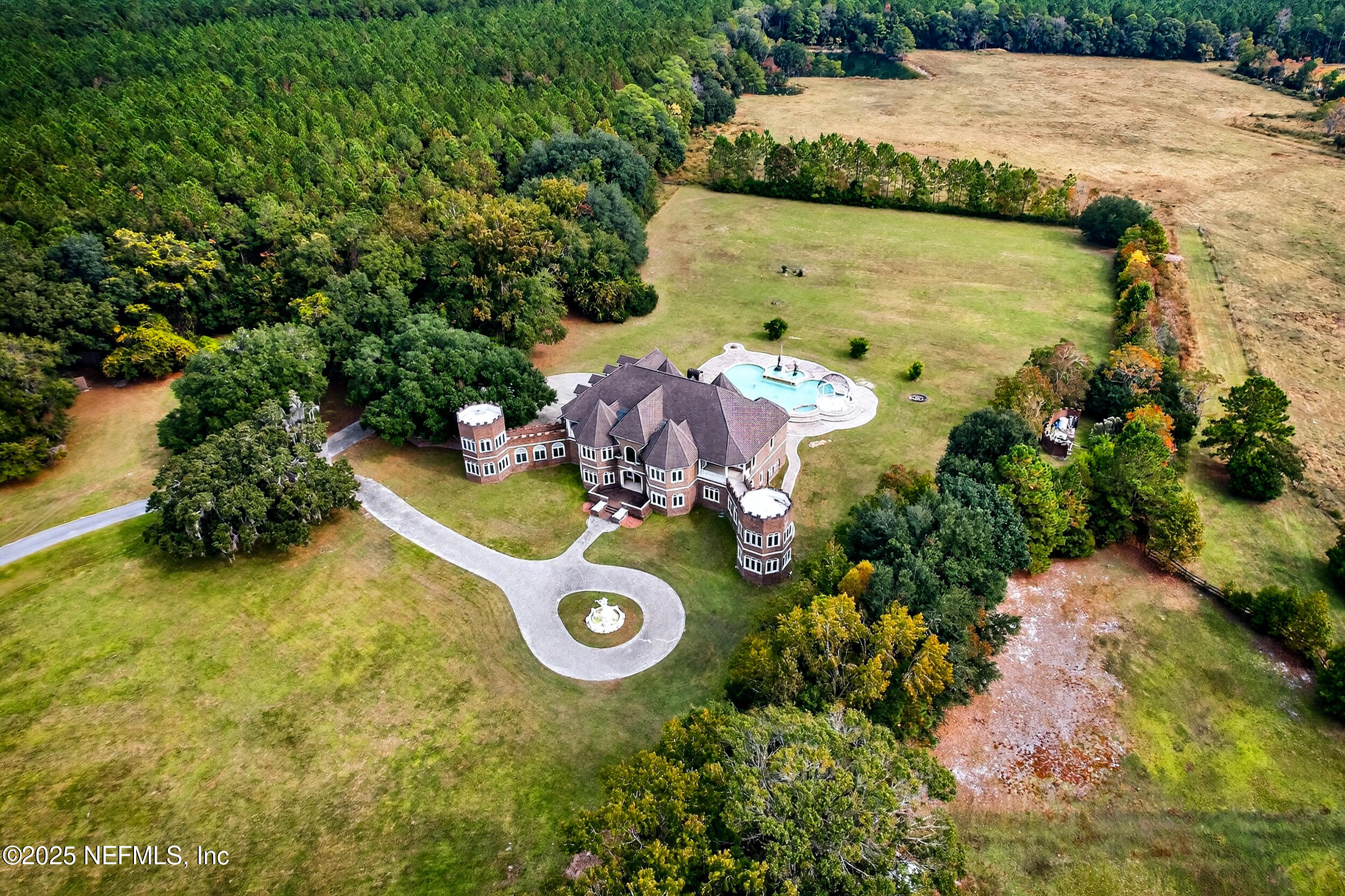 45500 Stratton Road Callahan, FL 32011 - Photo 54 of 58 an aerial view of a house with yard swimming pool and outdoor seating