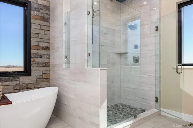 a bathroom with a bathtub and shower